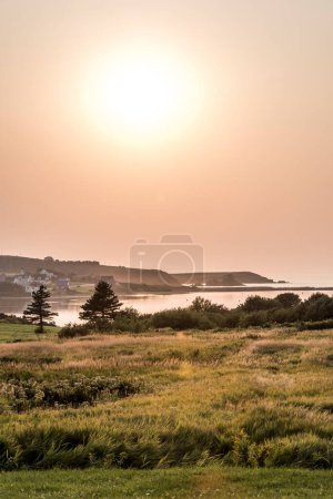 Photo for Stunning Sunset panoramic view of the Cape Breton Island Coast line cliff scenic Cabot Trail route, Nova Scotia Highlands Canada. - Royalty Free Image