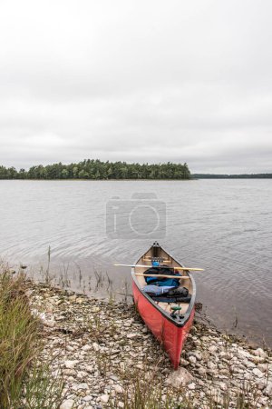Photo for Canoe ride on river and islands in morning mist at Kejimkujik National Park Designated Wilderness Nova Scotia Canada. - Royalty Free Image