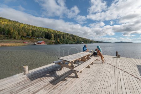 Photo for Breakfast at pier near the sea at skuleberget campsite caravan camping in Hoga Kusten Sweden. - Royalty Free Image