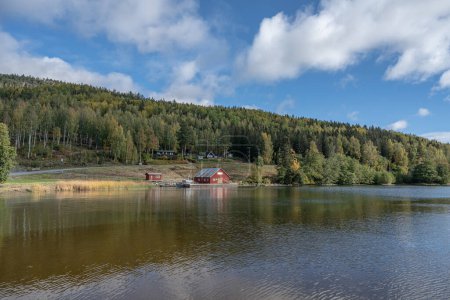 Photo for Swedish houses and mountain ant the sea at skuleberget campsite caravan camping in Hoga Kusten Sweden. - Royalty Free Image