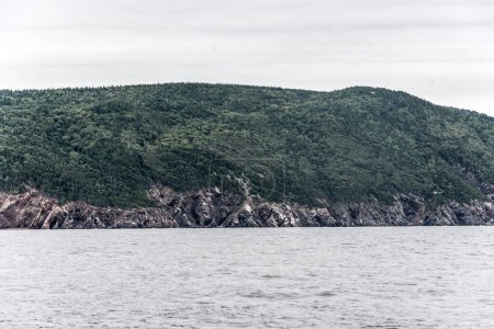 Photo for A panoramic view of the Cape Breton Island Coast line cliff scenic Cabot Trail route, Nova Scotia Hghlands Canada. - Royalty Free Image