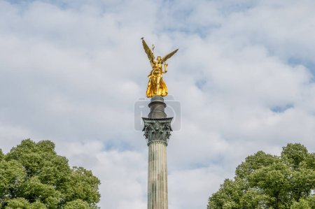 Photo for Golden peace angel Friedensengel in Muenchen City Statue Munich fountain. - Royalty Free Image