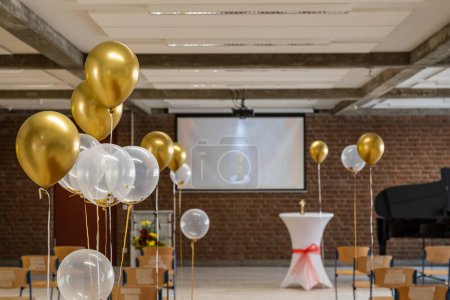 Photo for German Abitur Graduation party room decoration with Balloons and Award sculptures red carpet preparations for surprise party - Royalty Free Image