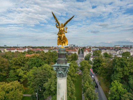 Photo for Munich Germany 30.08.2023 aerial golden peace angel Friedensengel in Muenchen City Statue Munich fountain. - Royalty Free Image