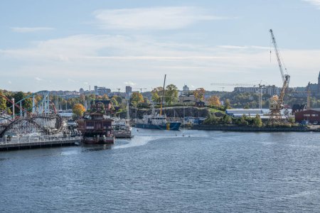 Photo for 27.09.2021 Sweden Stockholm View of coast guard harbour beside amusement park Grona Lund on Djurgarden island. - Royalty Free Image