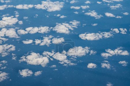 Photo for Aerial view of clouds and blue sky over ocean, cloudscape top view from airplane. - Royalty Free Image