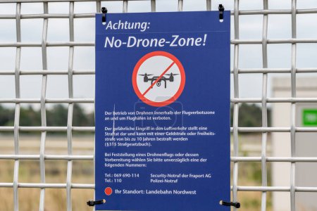 Photo for Frankfurt Germany 11.08.19 No-Drone-Zone warning sign on the fence near Frankfurt Airport. - Royalty Free Image