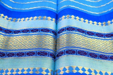 Foto de Blue silk sari background with gold colored border - Imagen libre de derechos
