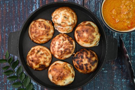 Photo for Indian breakfast kuzhi paniyaram in a frying pan - Royalty Free Image