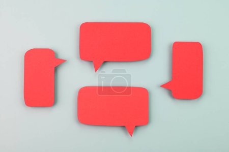 Red speech bubbles on a blue background