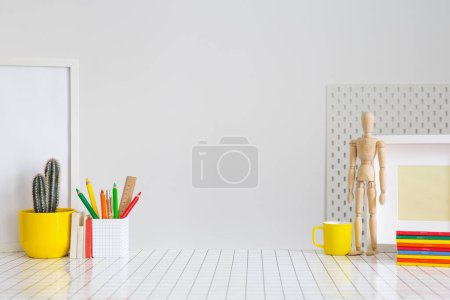 Photo for Student creative desk mock up with colorful office supplies and wall. Back to school. - Royalty Free Image