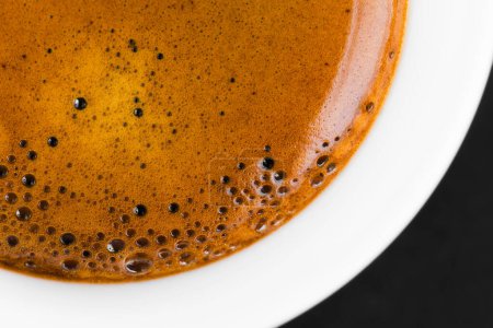 Photo for Cup of hot espresso coffee on  table. top view - Royalty Free Image