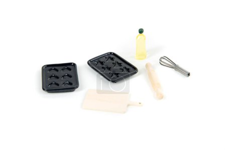 Doll baking set with muffin pans, oil, whisk, cutting board and rolling pin