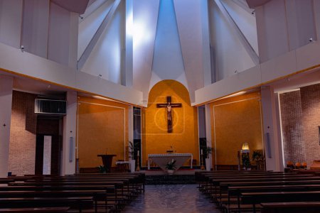 Numana Italy - 19 Sep 2023: Catholic modern church in Numana. Church interior, crucifix, beautiful lighting and decoration of the church space.