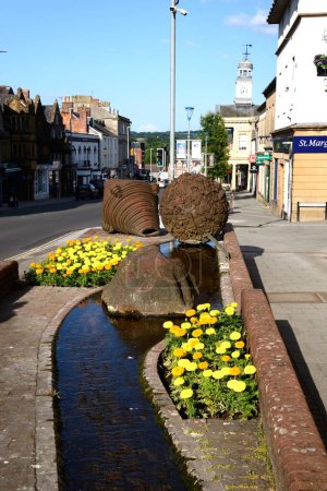 Photo for CHARD, UK - JUNE 22, 2023 - Boulder statues by Neville Cable views along Fore Street toward the Guildhall, Chard, Somerset, UK, Europe, June 22, 2023. - Royalty Free Image