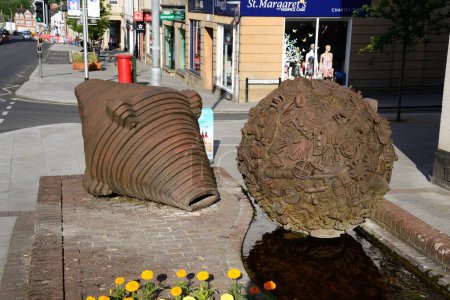 Photo for CHARD, UK - JUNE 22, 2023 - Boulder statues by Neville Cable along High Street with Fore Street to the rear, Chard, Somerset, UK, Europe, June 22, 2023. - Royalty Free Image