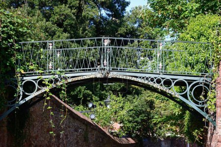 EXETER, UK - AUGUST 22, 2023 - View of Burnet Patch iron bridge along Cathedral Close, Exeter, Devon, UK, Europe, August 22, 2023.