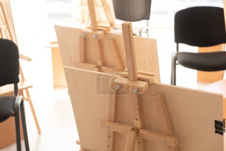 Photo for Empty easels in art studio, rear view, blur and selective focus. - Royalty Free Image