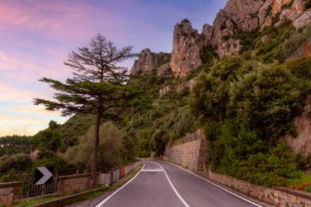Photo for Scenic Road by Rocky Cliffs and Mountain Landscape on the Tyrrhenian Sea. Amalfi Coast, Italy. Adventure Travel Background. Sunset Sky Art Render - Royalty Free Image