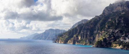 Photo for Touristic Town, Positano, on Rocky Cliffs and Mountain Landscape by the Tyrrhenian Sea. Amalfi Coast, Italy. Panoramic View - Royalty Free Image