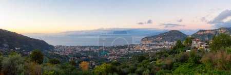Photo for View of Touristic Town, Sorrento, Italy. Coast of Tyrrhenian Sea. Cloudy Sky Sunset. Panorama - Royalty Free Image