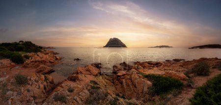 Photo for Rocky Beach on the Mediterranean Sea. Punta Don Diego, Sardinia, Italy. Dramatic Sunrise Sky Art Render. Nature Background Panorama - Royalty Free Image