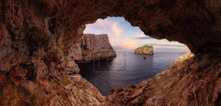 Photo for Cave on Rocky Coast with Cliffs on the Mediterranean Sea. Sunset Sky Art Render. Regional Natural Park of Porto Conte, Sardinia, Italy. Nature Background. - Royalty Free Image