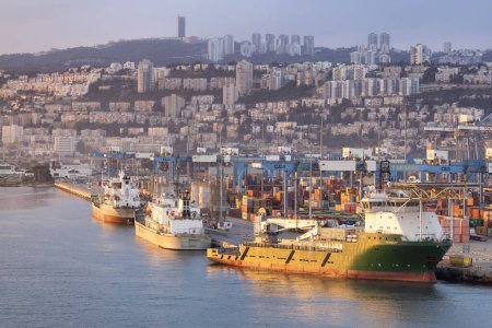 Photo for Haifa, Israel - November 6, 2022: Port of Haifa during dramatic sunrise. View from cruise ship. - Royalty Free Image