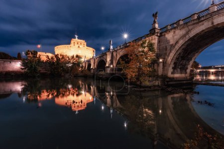Photo for Old Historic Bridge, St. Angelo Bridge, over River Tiber at night. Rome, Italy. - Royalty Free Image