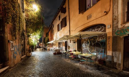 Photo for Rome, Italy - November 15, 2022: Old Historic Streets in Downtown. Rainy Night. - Royalty Free Image