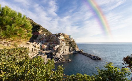 Foto de Small touristic town on the coast, Manarola, Italy. Cinque Terre. Sunny Fall Season day. Rain Sky Art Render - Imagen libre de derechos