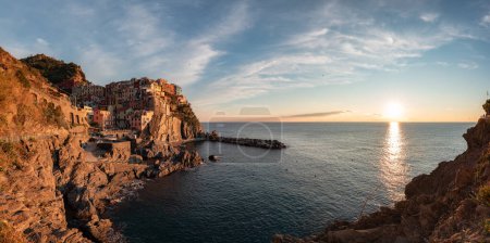 Foto de Small touristic town on the coast, Manarola, Italy. Cinque Terre. Colorful Sunny Sunset Fall Season. Panorama - Imagen libre de derechos