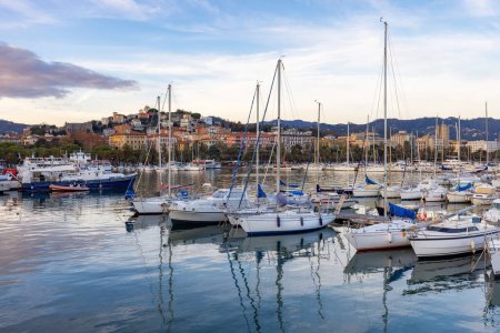 Photo for Boats at a marina in a touristic city, La Spezia, Italy. Sunset Sky. - Royalty Free Image