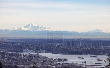 Photo for Developed city with industrial and residential buildings. Mount Baker in Background. Vancouver, British Columbia, Canada. - Royalty Free Image