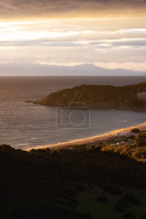 Foto de Touristic Town on the Sea Coast. Solanas, Sardinia, Italy. Colorful Sunset Sky. - Imagen libre de derechos