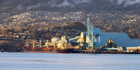Téléchargez les photos : Industrial Site with Tanker Ship in North Vancouver, British Columbia, Canada. Winter Sunset - en image libre de droit
