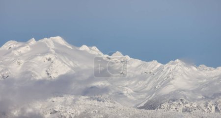 Téléchargez les photos : Snow and Cloud covered Canadian Nature Landscape Background. Winter Season in Whistler, British Columbia, Canada. From Blackcomb Mountain - en image libre de droit