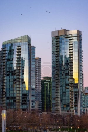 Photo for Residential Highrise Apartment Buildings in Coal Harbour, Downtown Vancouver, British Columbia, Canada. Winter Sunrise - Royalty Free Image