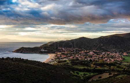 Foto de Touristic Town on the Sea Coast. Solanas, Sardinia, Italy. Colorful Sunset Sky. - Imagen libre de derechos