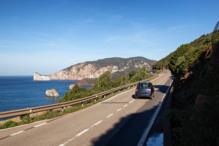 Téléchargez les photos : Scenic Highway on the Sea Coast during Sunny Fall Season Day. Sardinia, Italy - en image libre de droit