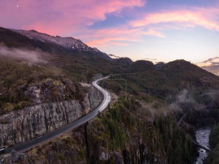 Photo for Sea to Sky Highway in Canadian Mountain Landscape. Sunrise Sky Art Render. Between Whistler and Squamish, BC, Canada. Aerial - Royalty Free Image