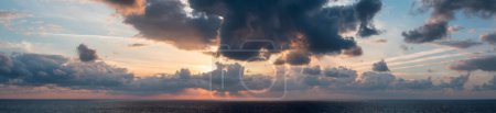 Photo for Dramatic Colorful Sunset Sky over Mediterranean Sea. Clouds with Sunrays. Cloudscape Nature Background. Panorama - Royalty Free Image
