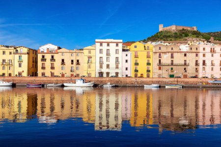 Foto de River with Homes and Apartments in Touristic Town. Bosa, Sardinia, Italy. Sunny Fall Season Day. Panorama - Imagen libre de derechos