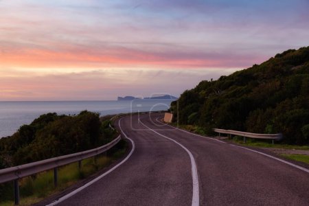 Téléchargez les photos : Scenic Highway on the Sea Coast during Sunny Fall Season Sunset. Sardinia, Italy. Adventure Travel - en image libre de droit