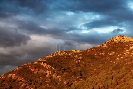 Photo for Rocky Mountains on the Sea Coast of Sardinia, Italy. Dramatic Sunset Sky. Nature Background. - Royalty Free Image
