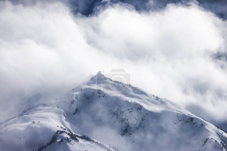 Photo for Snow and Cloud covered Canadian Nature Mountain Landscape Background. Winter Season in Whistler, British Columbia, Canada. - Royalty Free Image