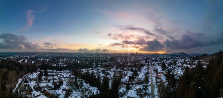 Photo for Modern City Suburban Neighborhood covered in snow. Burnaby, Vancouver, BC, Canada. Aerial Panorama. Winter Sunset - Royalty Free Image