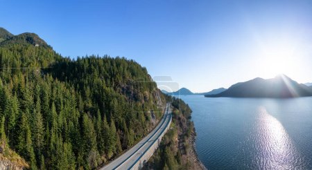 Photo for Aerial View of Sea to Sky Highway in Howe Sound. Sunset Sky. Between Squamish and Vancouver, BC, Canada. Panorama Background - Royalty Free Image