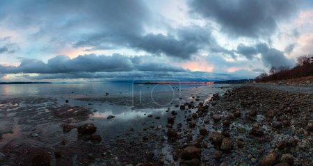 Photo for Rocky Beach and White Rock Pier on the West Coast of Pacific Ocean. Dramatic Cloudy Sunset Sky. Vancouver, British Columbia, Canada. Panorama - Royalty Free Image