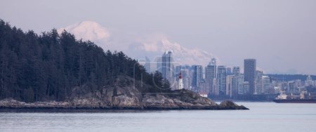 Photo for Lighthouse Park and City with Mountains in Background. Sunset. West Vancouver, British Columbia, Canada. - Royalty Free Image